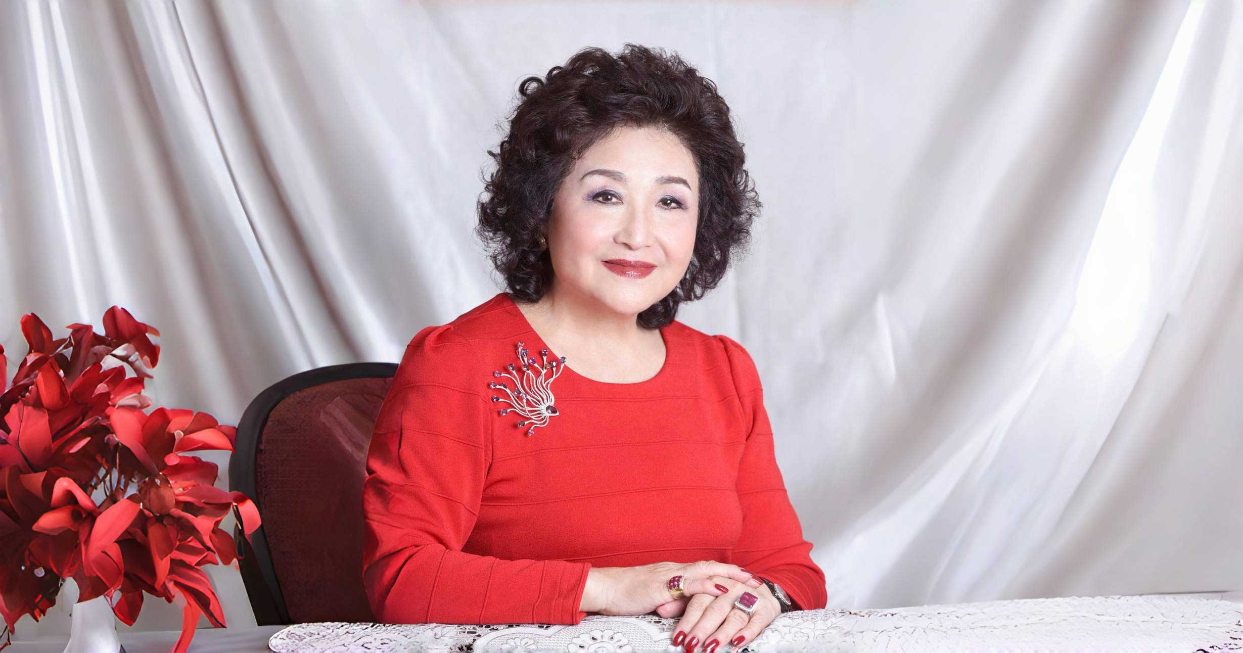This is a picture of SUPERVISOR of Funful Kindergarten & Children's Corner, Dr Lady Delia Pei KMFAP BBS JP in red
